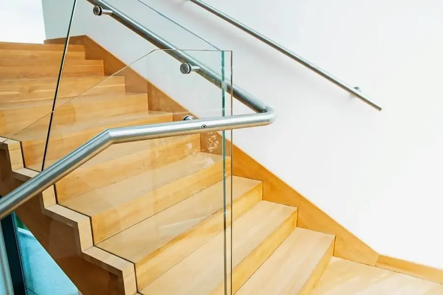 Timber staircase with a glass balustrade