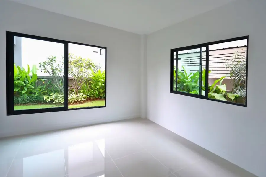 Empty room with new sliding windows ahead of installation