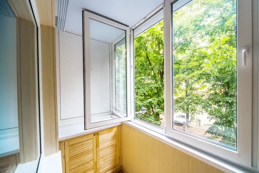 Corner window nook with a view of surrounding trees