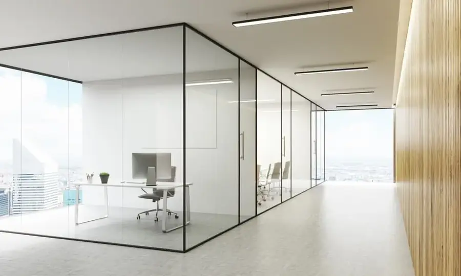 Open-plan commercial office fitted with glass partitions