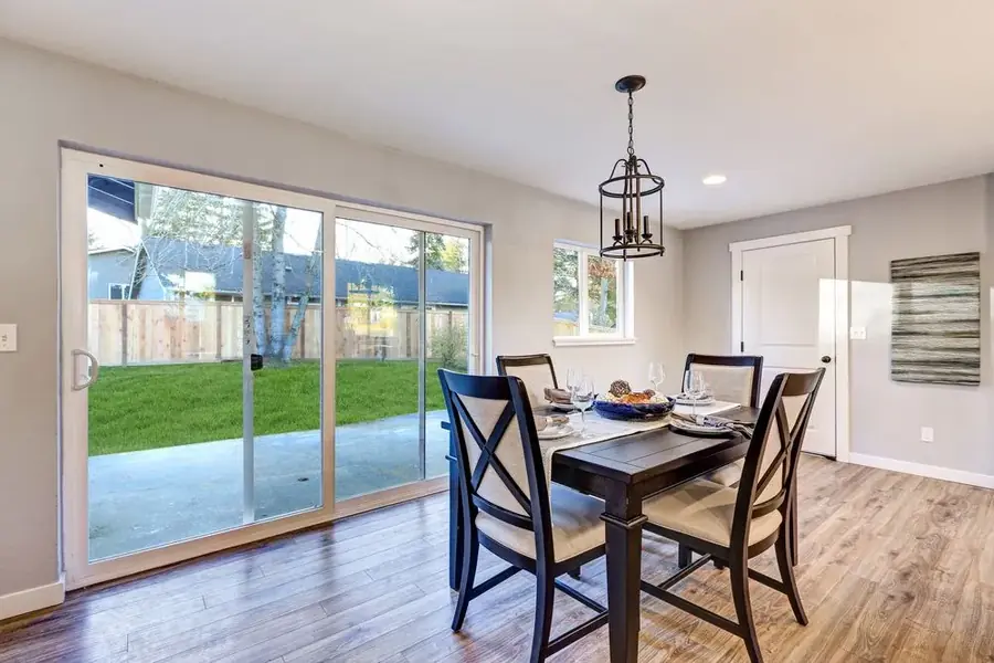 Sliding glass doors opening a living area onto a garden