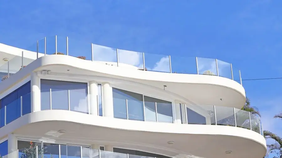 Floor-to-ceiling office glazing overlooking the city