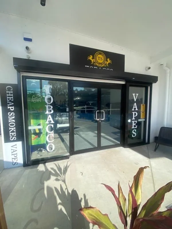 Shop front with new glass door after repair, Gold Coast